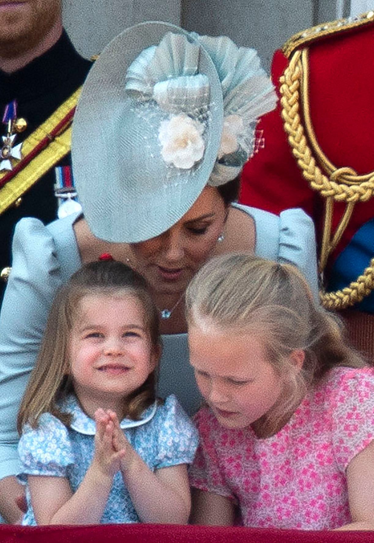 Britiain's Duchess of Cambridge with Princess Charlotte and Savannah Phillips (R) watch the flypast on the balcony of Buckingham Palace during the Trooping of the Colour, the Queen's 92th birthday