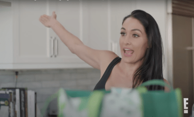 Nikki Bella yells With Her Arm in the Air on Total Bellas