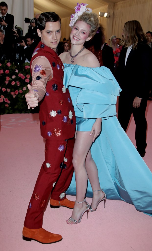 Cole Sprouse in Red Suit With Patches Lili Reinhart in Blue Dress and Big Updo at 2019 Met Gala
