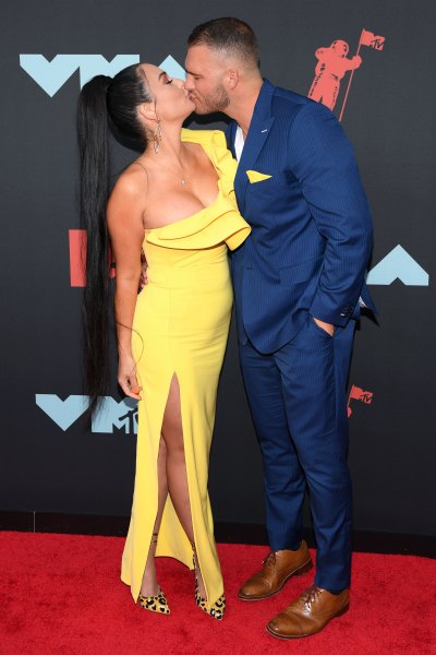 Jenni Farley Wears Yellow Gown and Kisses Boyfriend Zack Clayton Carpinello in Blue Suit With Yellow Accents