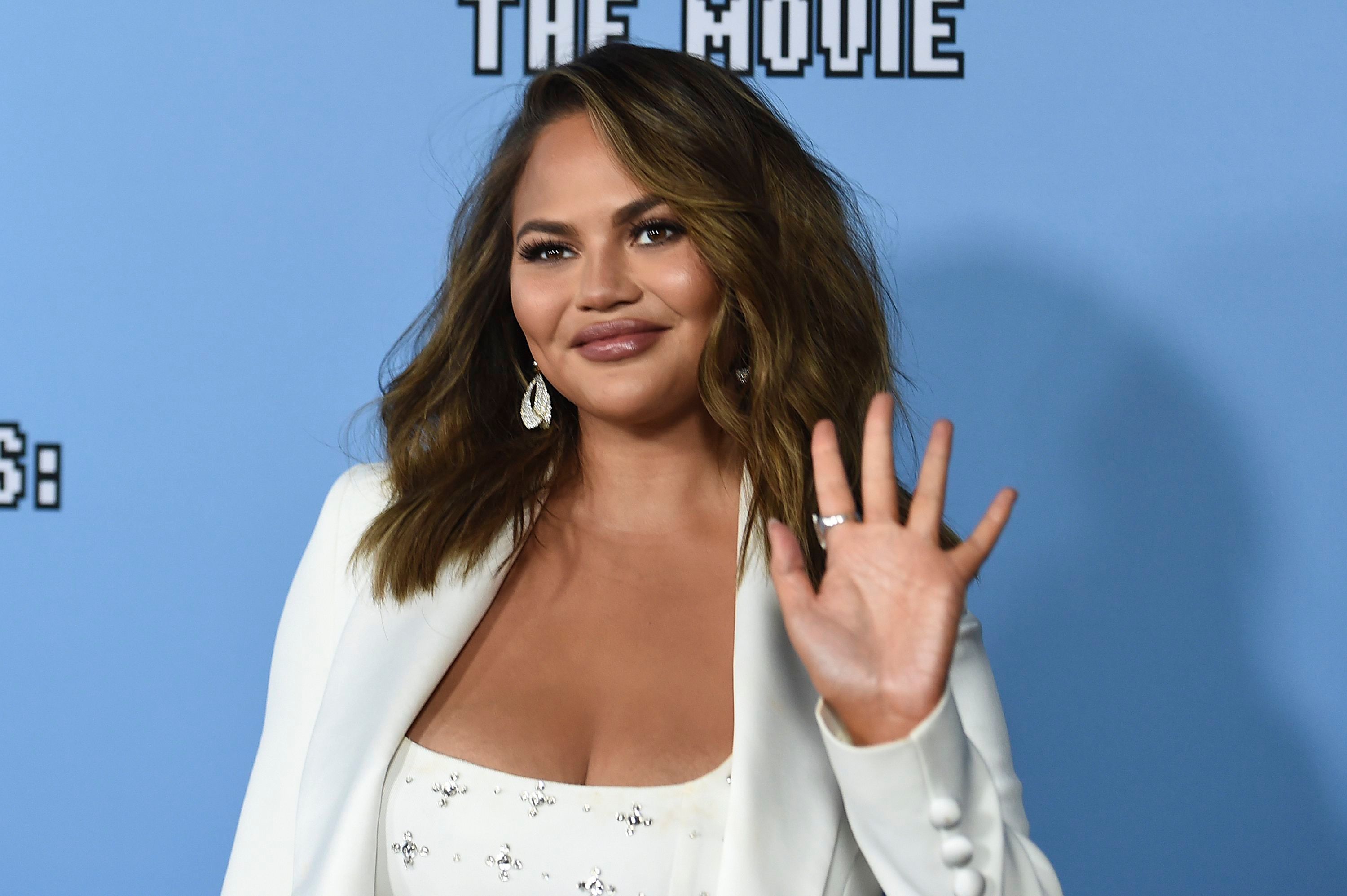 Topless Beach Perky - Chrissy Teigen Removing Breast Implants: 'I'm Getting My Boobs Out!'