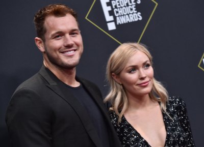 Bachelor Colton Underwood Wears Black Suit With Cassie Randolph in Black Dress on Red Carpet