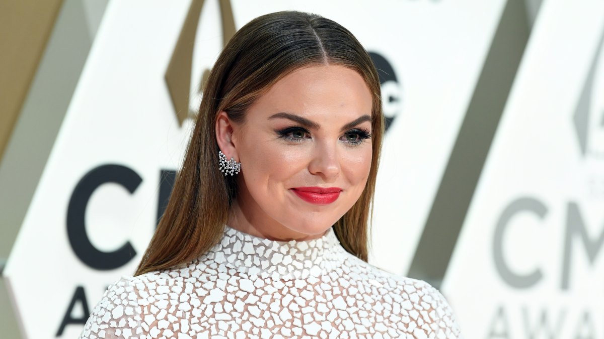 Hannah Brown Wears White Gown at CMAs With Red Lipstick