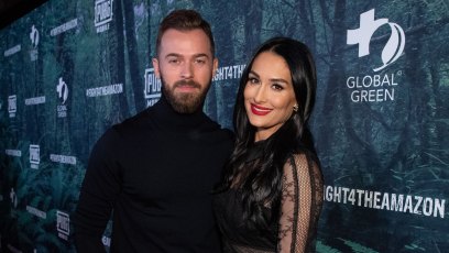 Nikki Bella Smiles in Black Dress and Red Lipstick With Fiance Artem Chigvintsev in Black Turtleneck