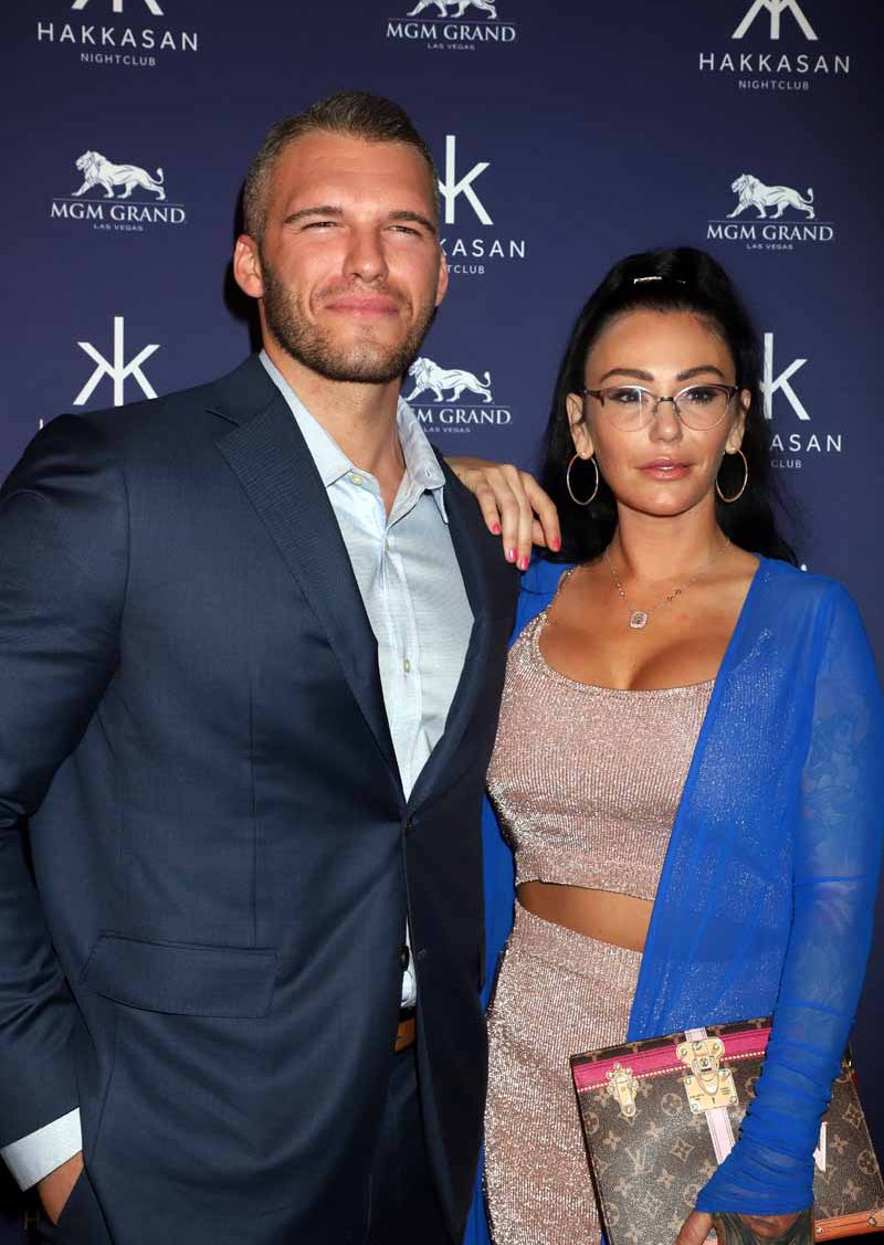 Jenni JWoww Farley Wears Blue Cardigan and Nude Two Piece Outfit and Boyfriend Zack Clayton Wears Suit
