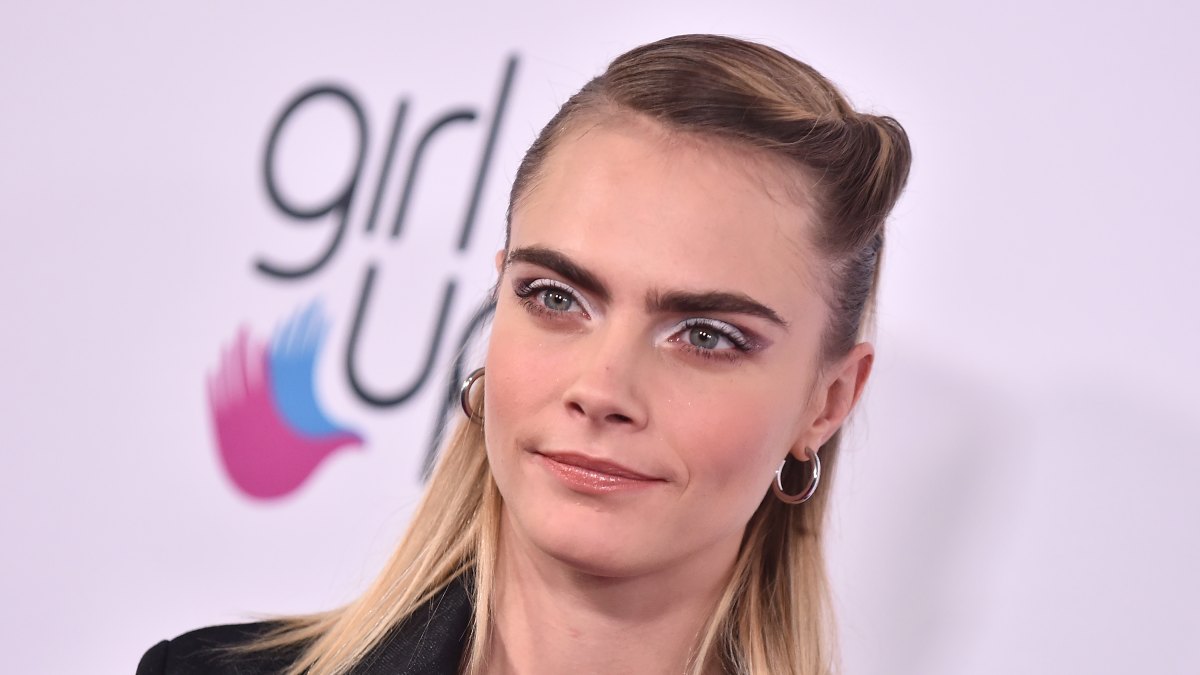 Cara Delevingne Wears Hair Half Up and Denim Jumpsuit