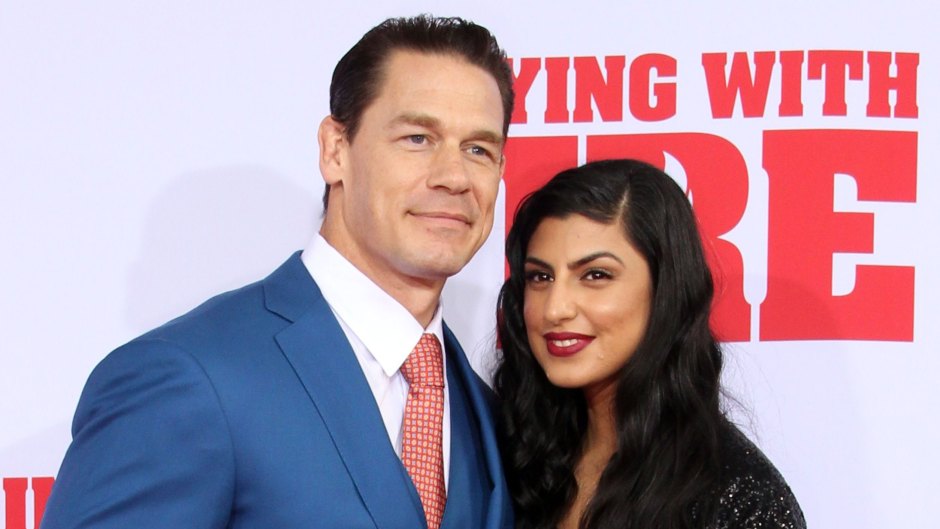 John Cena and Shay Shariatzadeh Cuddle Up on Playing With Fire Red Carpet
