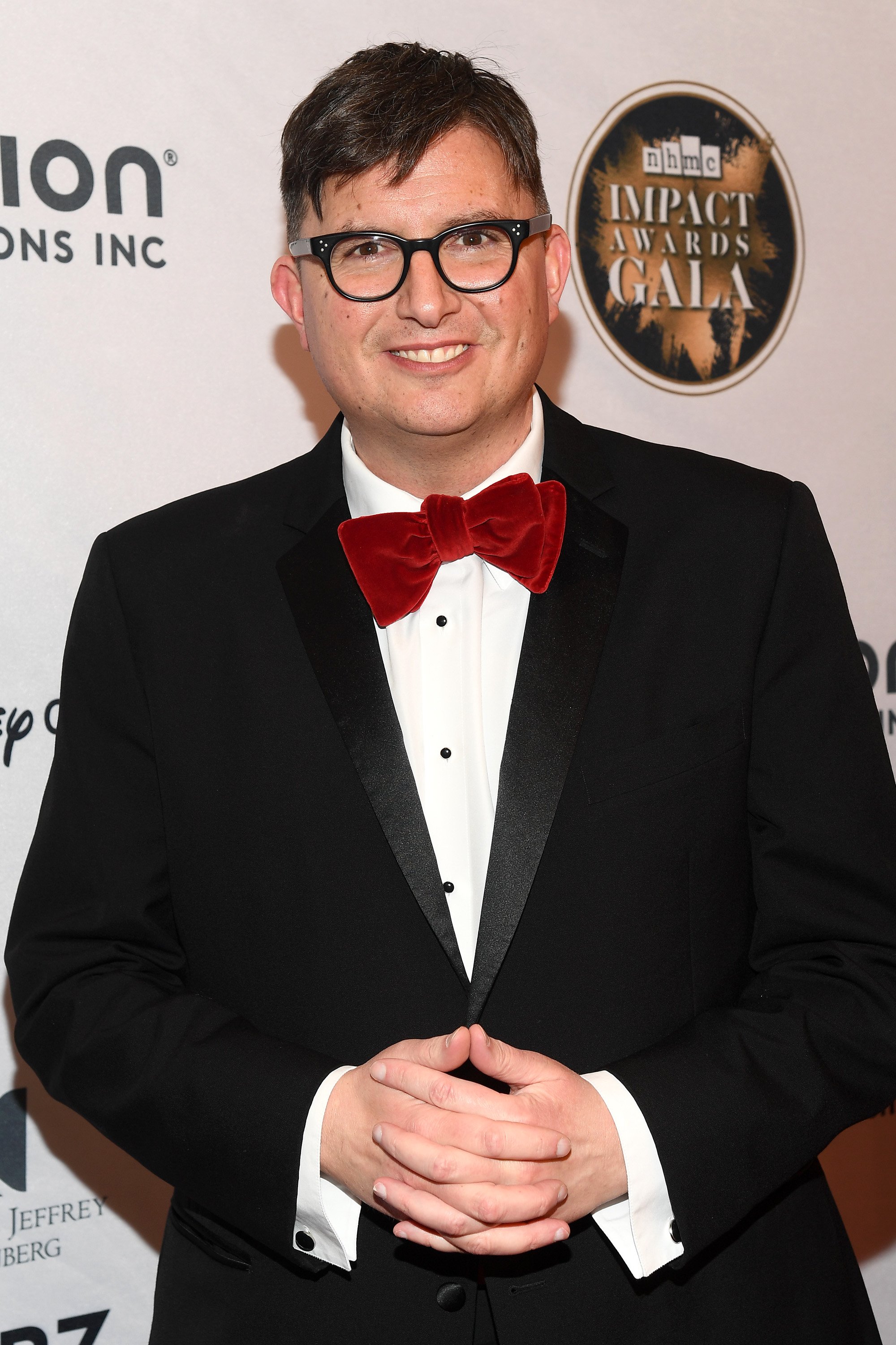 ‘Riverdale’ Creator Roberto Aguirre-Sacasa Wears Suit and Red Bowtie