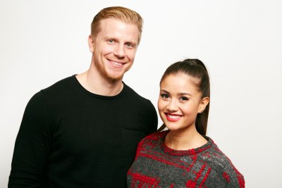 Bachelor Sean Lowe Smiles in Black Shirt With Wife Catherine Giudici in Grey and Red Sweater and Ponytail