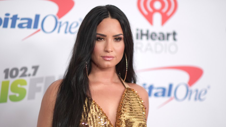 Demi Lovato Looks Serious in Gold Halter Dress and Long Straightened Hair