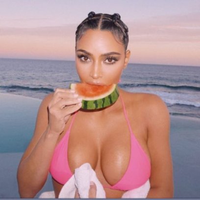 Kim Kardashian Wears a Hot Pink String Bikini