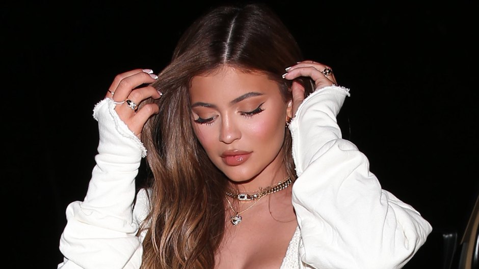 Kylie Jenner Flaunts Her Toned Tummy in an All-White Outfit With Fun Accessories