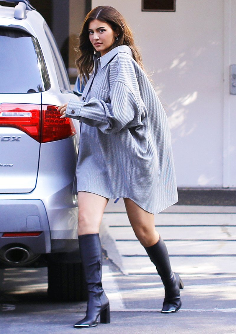 Kylie Jenner Wearing an Oversized Shirt and Tall Boots
