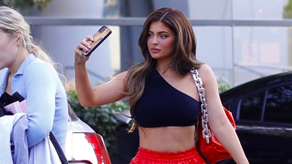 Kylie Jenner Shows Abs in Red Pants and Black Crop Top feature