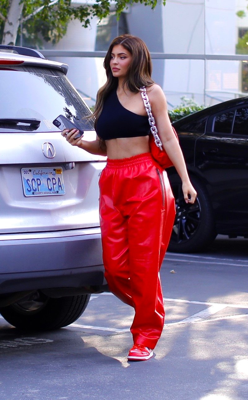 Kylie Jenner Shows Abs in Red Pants and Black Crop Top 5