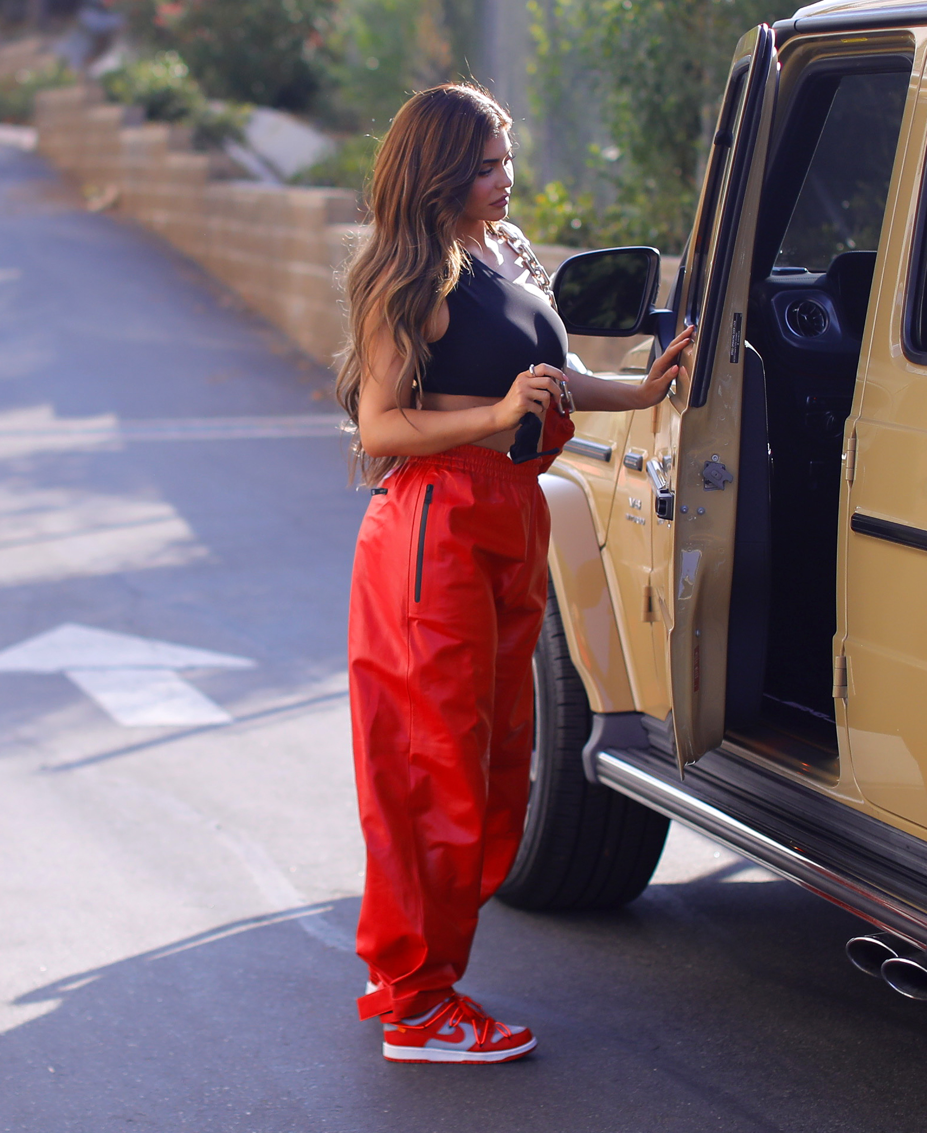 Kylie Jenner Shows Abs in Red Pants and Black Crop Top 4