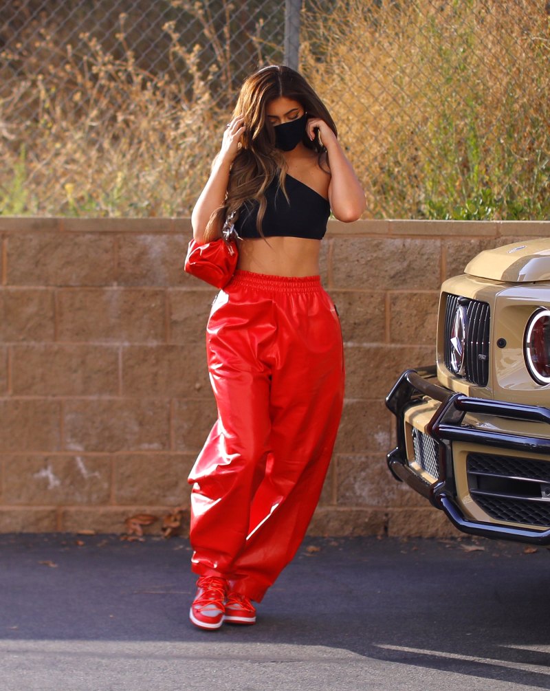 Kylie Jenner Shows Abs in Red Pants and Black Crop Top 1