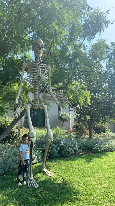 Kourtney Kardashian Decorates Her Backyard With a Giant-Sized Skeleton for Halloween
