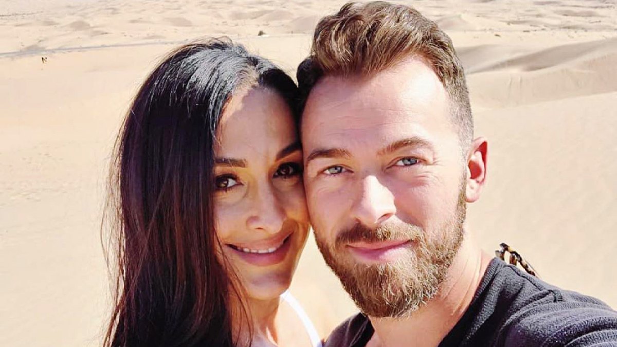 Proud Parents Nikki Bella and Artem Chigvintsev Pack on the PDA While He Cooks Dinner