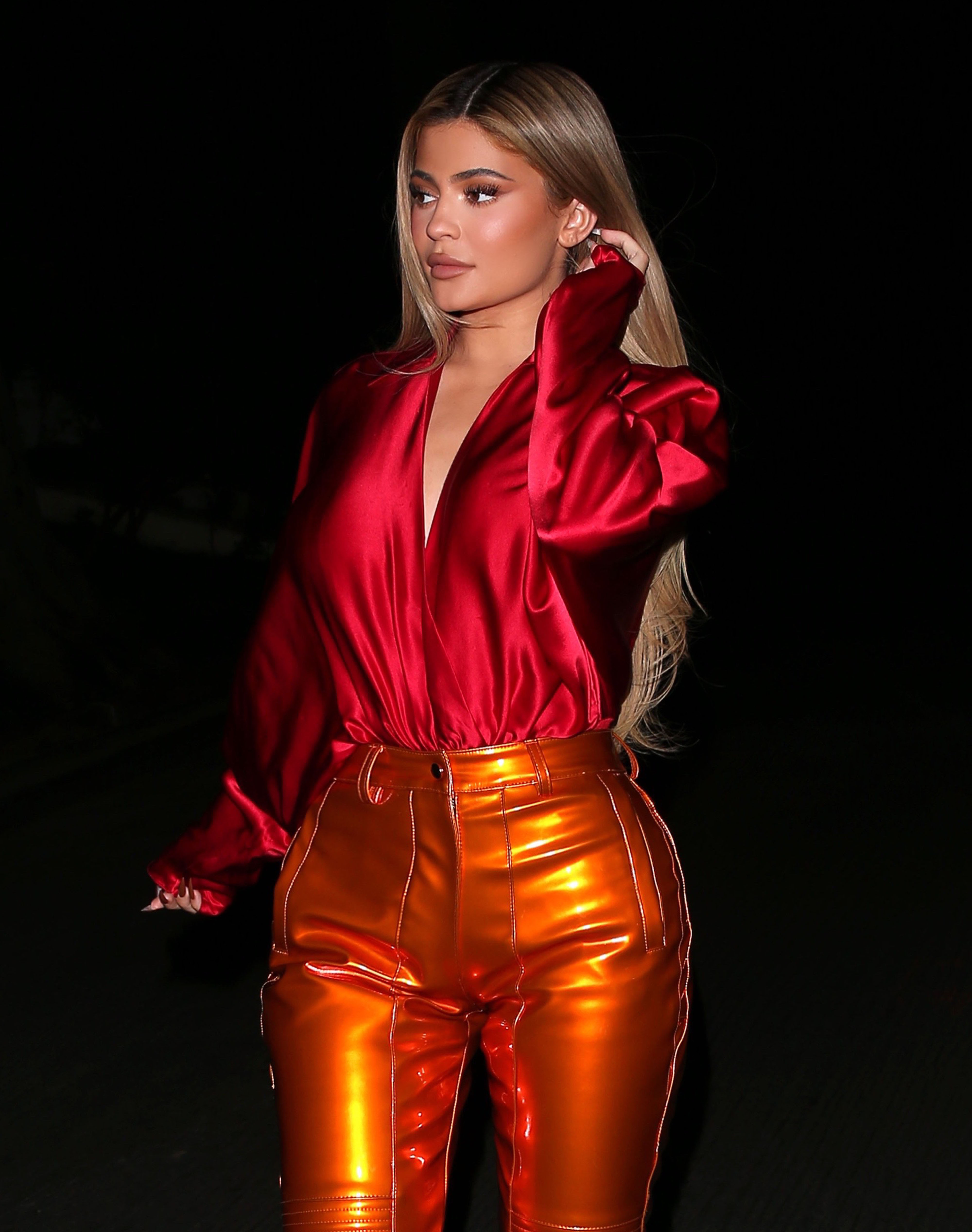 Red Hot! Kylie Jenner Stuns in a Silky Top and Form-Fitting Orange Pants While Out to Dinner