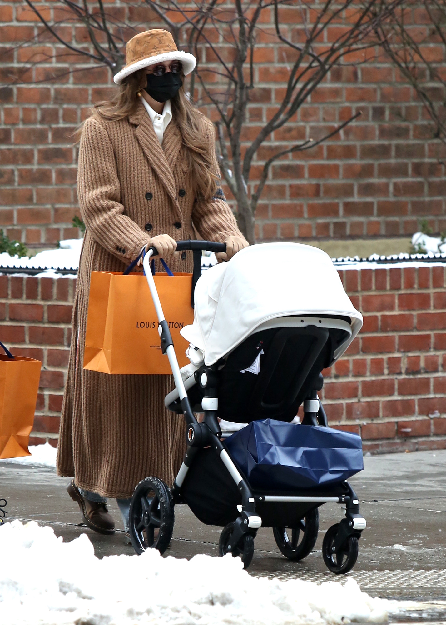 Gigi Hadid Spotted Shopping with Daughter in Soho