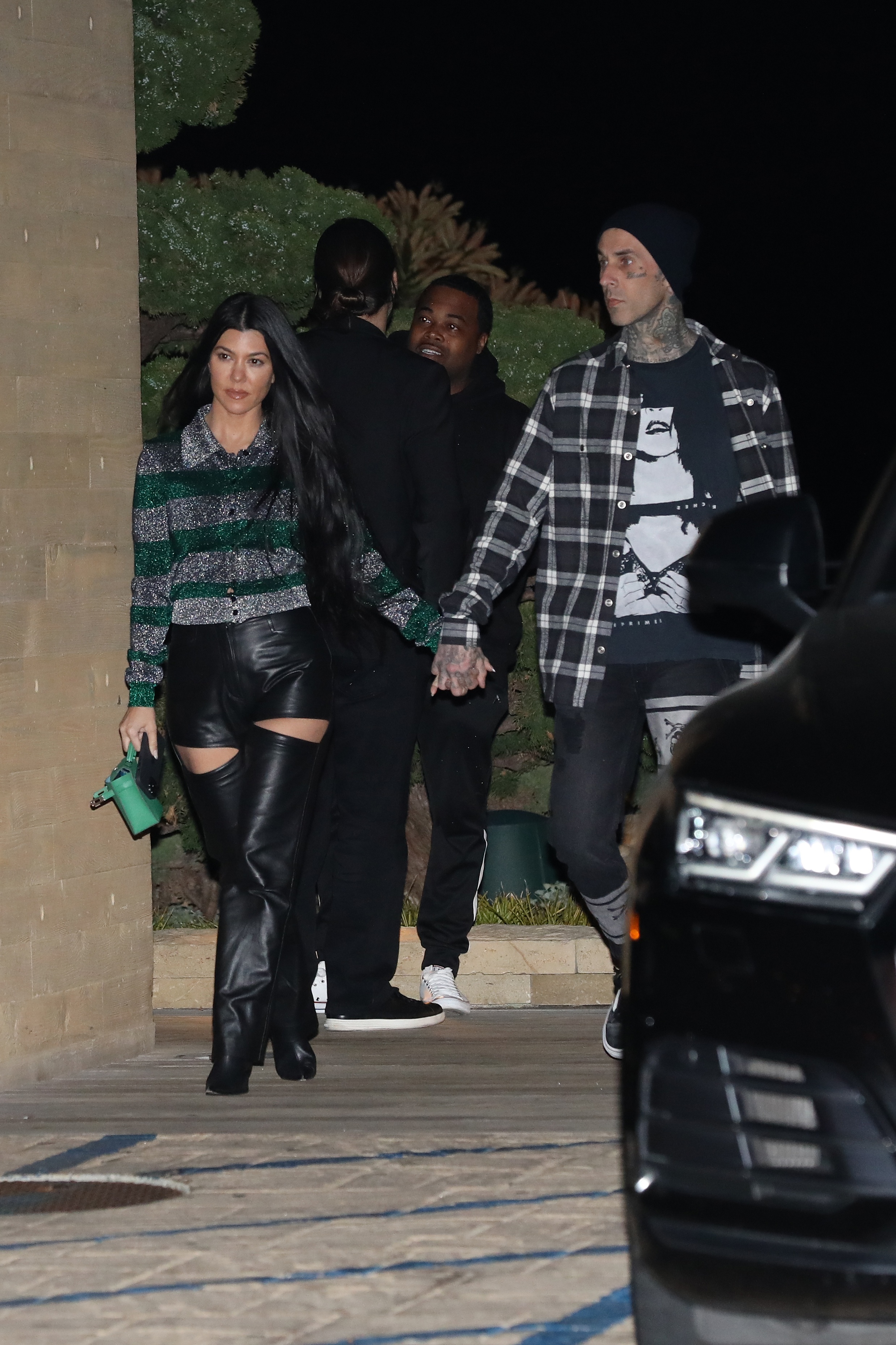 Kourtney Kardashian and Travis Barker Holding Hands
