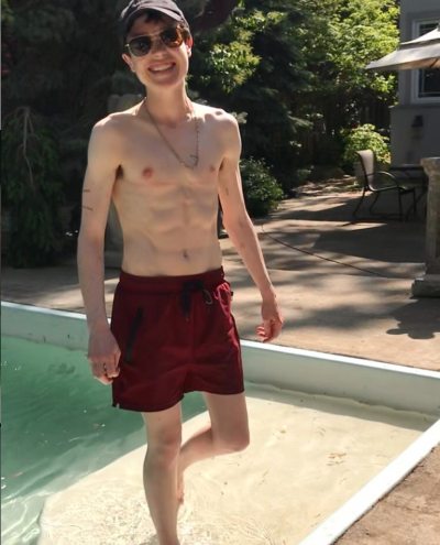 Elliot Page Shows Off Abs in Shirtless Pool Shot: ‘Trans Bb’s First Swim Trunks’