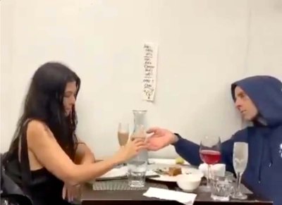 Kourtney Kardashian Travis Barker Hold Hands Over Dinner Sign Tells Them Keep Clean