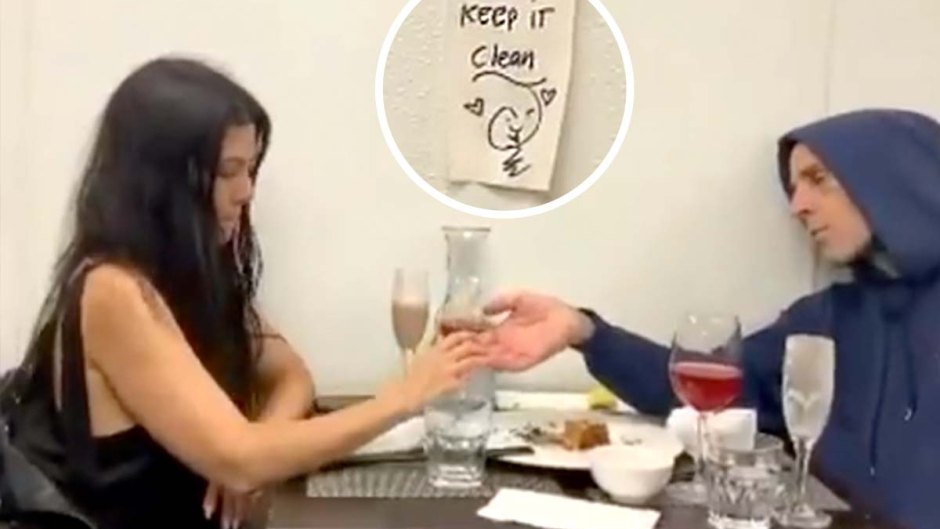 Kourtney Kardashian Travis Barker Hold Hands Over Dinner Sign Tells Them Keep Clean