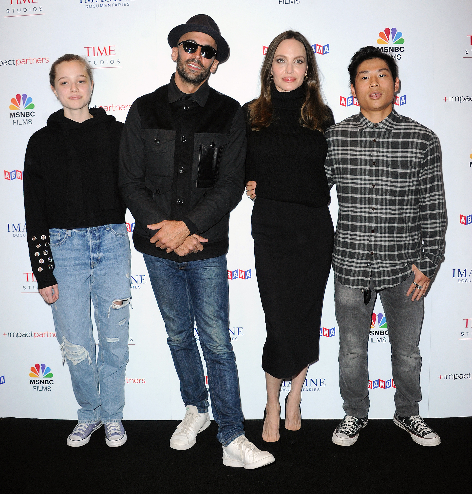 Jolie-Pitt Wears Ripped Jeans and Hoodie on Carpet