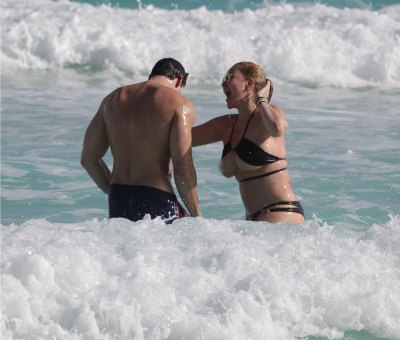 Shanna Moakler Suffers Major Wardrobe Malfunction With Bikini Top Slip While Frolicking on Vacation With Matthew Rondeau
