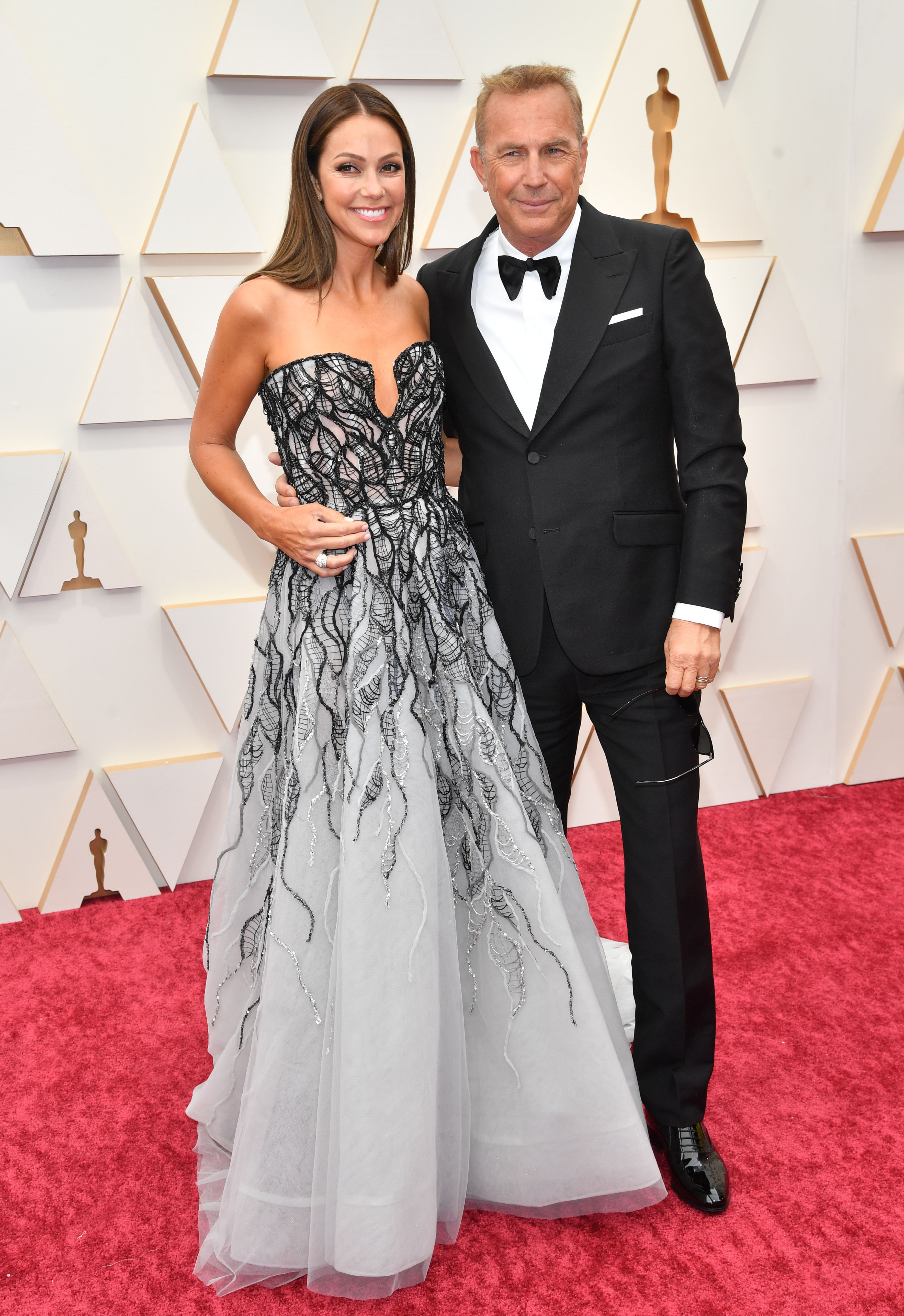 Kevin Costner, Wife Christine Baumgartner Walk Oscars 2022 Red Carpet image