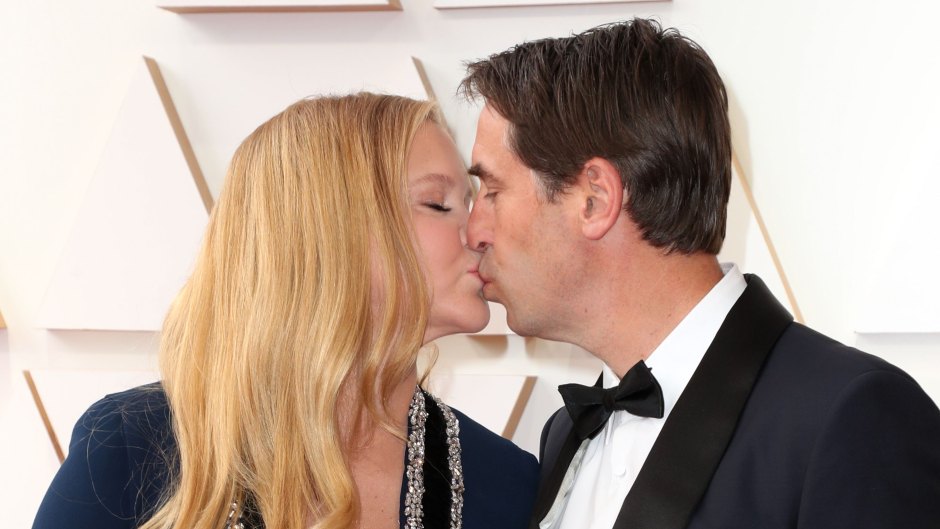 Amy Schumer and Husband Chris Fischer Kiss at Oscars 2022