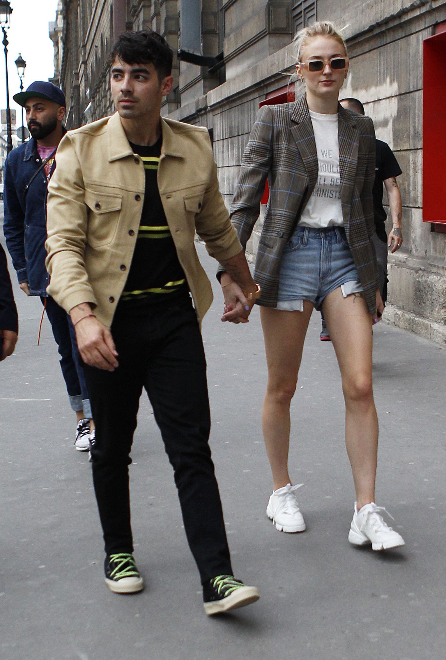 Joe Jonas Tan Jacket Black Jeans Holding Hands Sophie Turner Denim Shorts Blazer