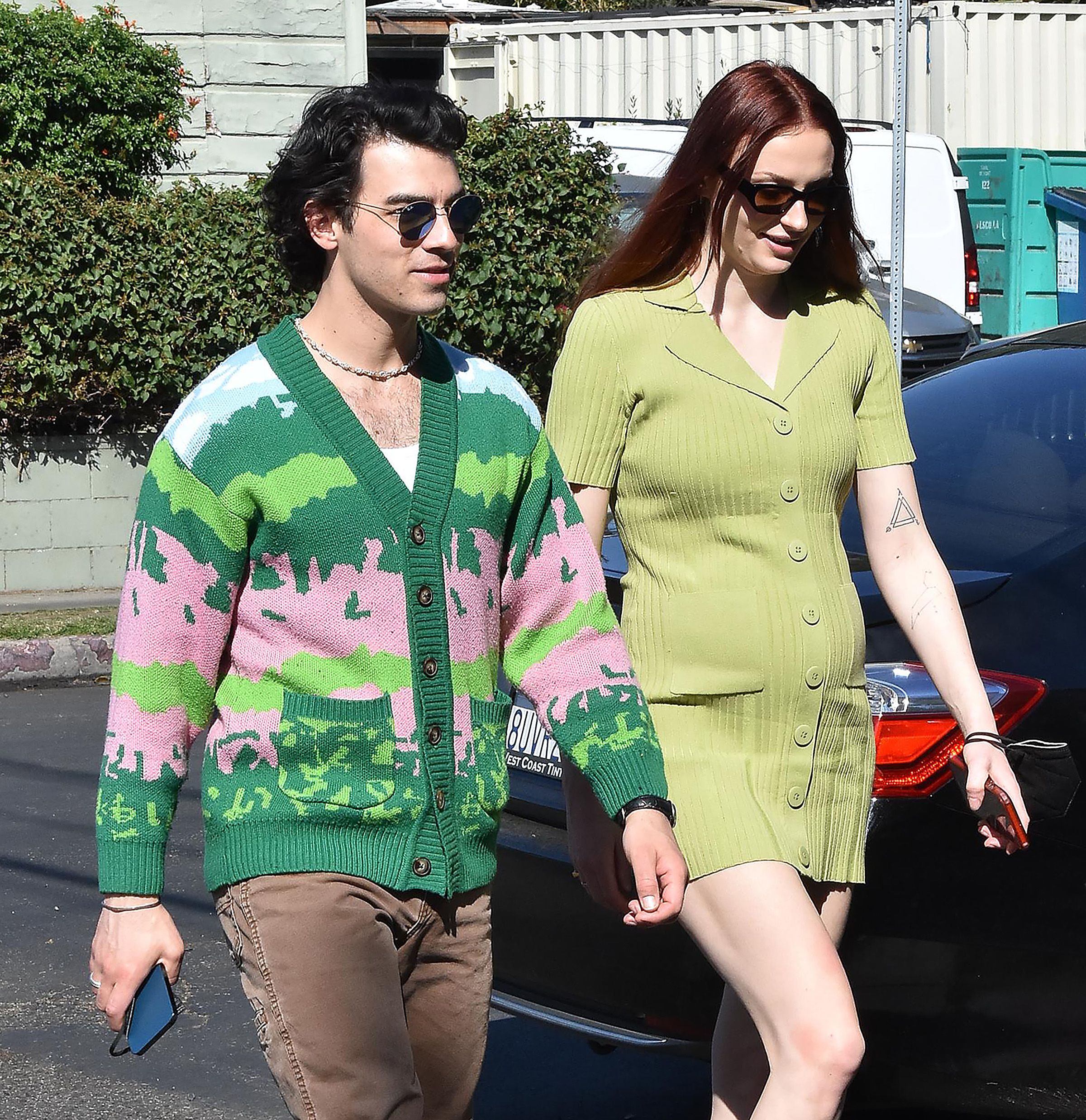 Sophie Turner Green Dress Baby Bump Joe Jonas Green and Pink Sweater