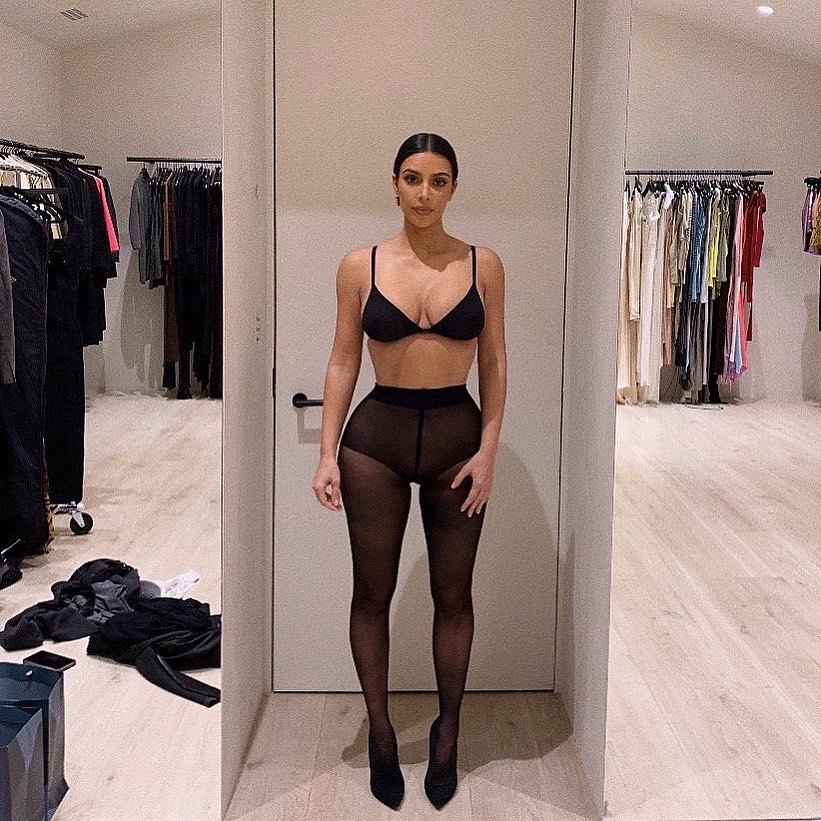 Kim Kardashian shows off her famous curves in tight Skims catsuit