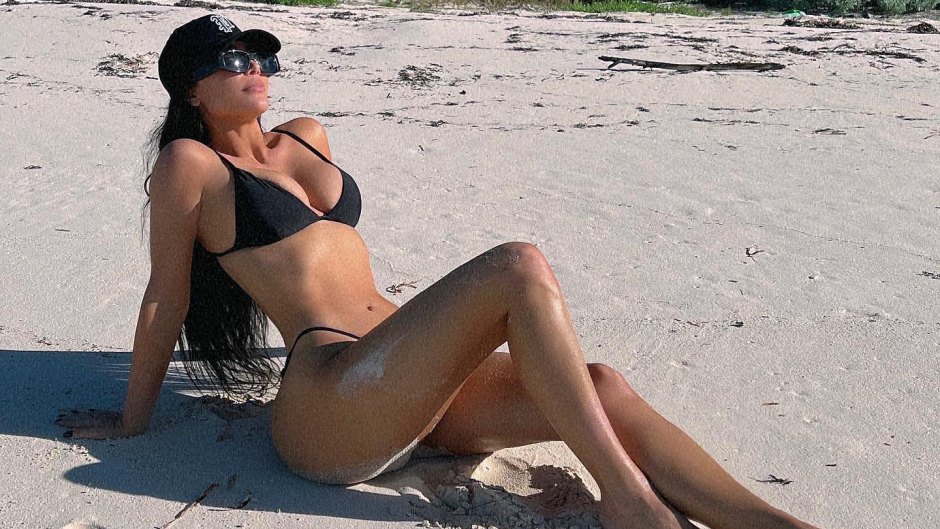 Kim Kardashian Flaunts Full Bum in Thong Bikini