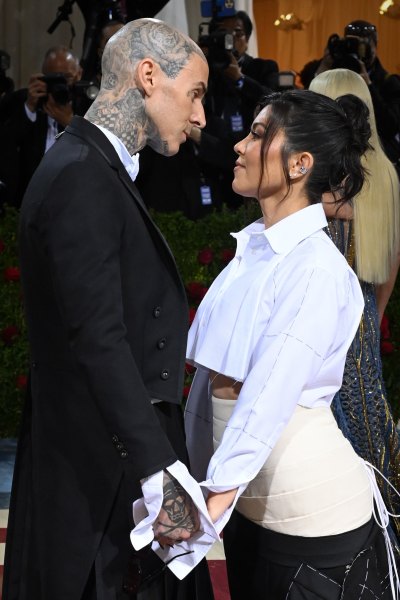 Travis Barker Shares Steamy Photos With Kourtney Kardashian Kissing Her Thigh: ‘Afterparty’