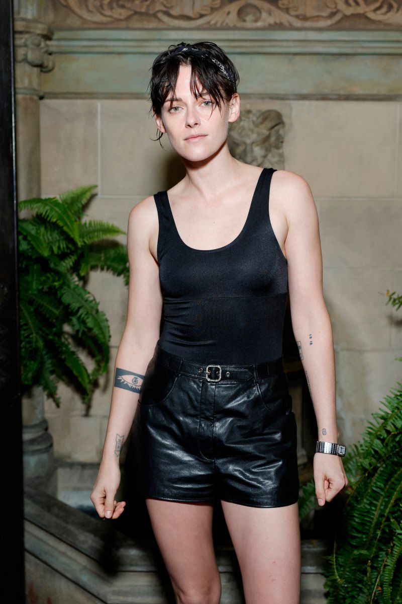 Kristen Stewart wearing a black tank top and black shorts at the Chanel dinner.