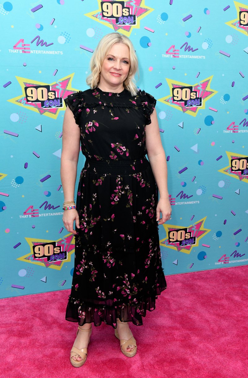 Melissa Joan Hart wearing a black floral dress.