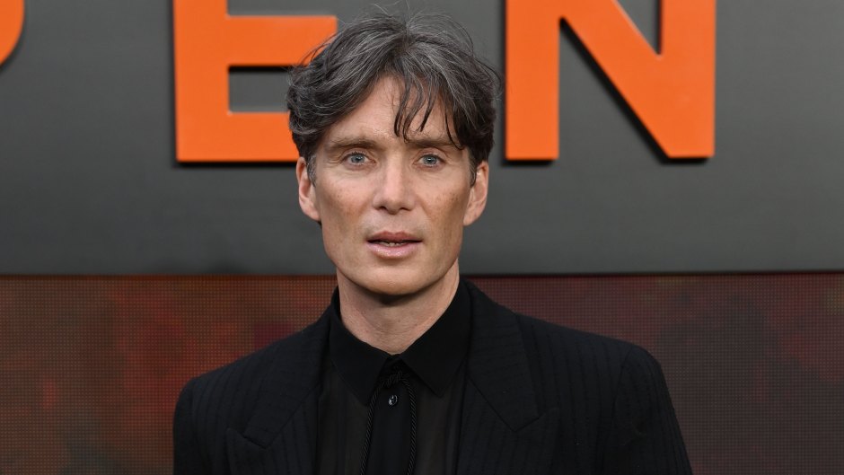 Cillian Murphy poses in an all-black suit at the Oppenheimer premiere