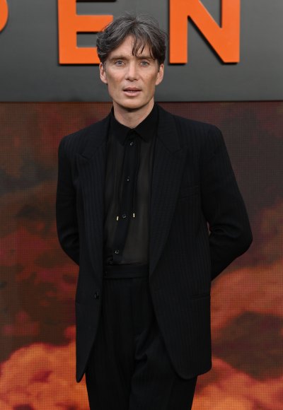 Cillian Murphy poses in an all-black suit at the Oppenheimer premiere