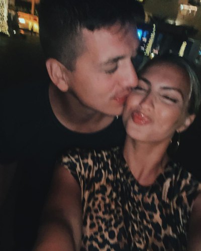 Tori Kelly's husband Andre Murillo kisses her on the cheek as she purses her lips