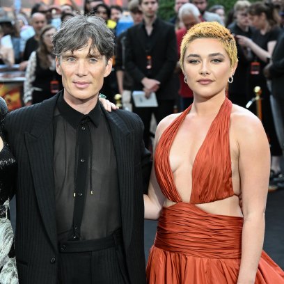 Emily Blunt Cillian Murphy and Florence Pugh standing at the premiere of Oppenheimer