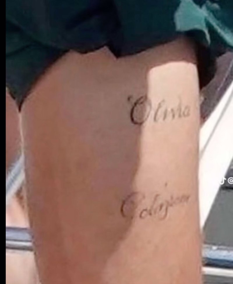 A photo of Harry Styles' leg with tattoos that read Olivia and Colazione