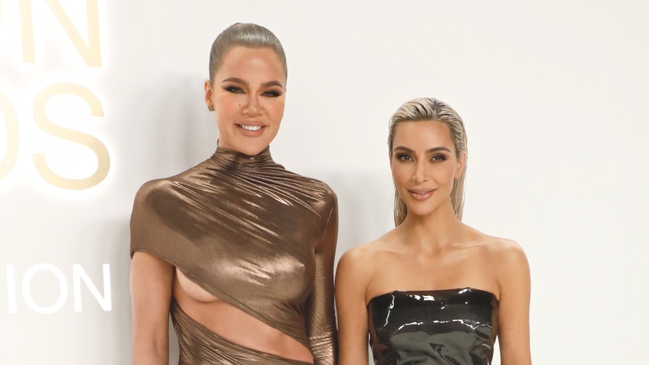 Khloe and Kim Kardashian wearing gold and black dresses at CFDA Awards