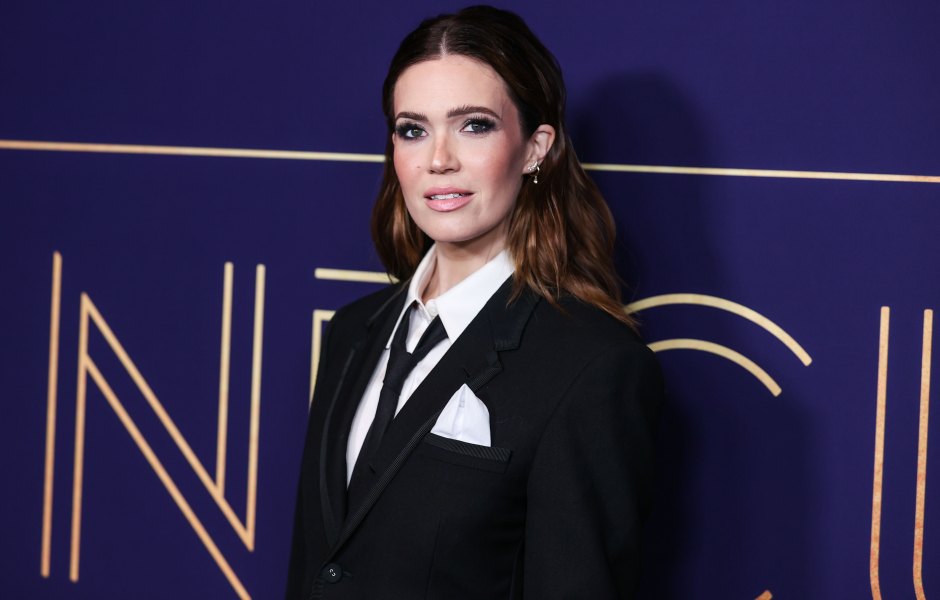 Mandy Moore wearing a black tie and suit