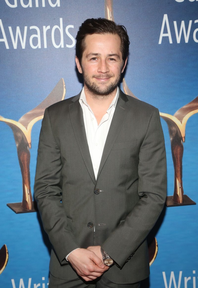Michael Arangano wearing a charcoal suit at the Writer's Guild Awards