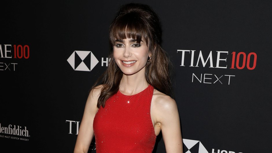 Lily Collins posing at the Time100 Gala in a red dress