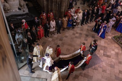 King Charles walking out of Westminster Abbey on his coronation day